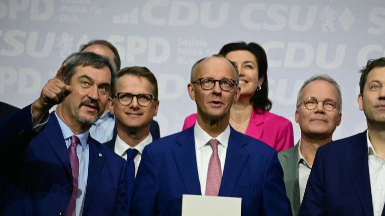 38005973-the-leader-of-germany-conservative-christian-democratic-union-cdu-party-friedrich-merz-the-co-chairman-of-germany-social-democratic-party-spd-lars-22MBve7isx70